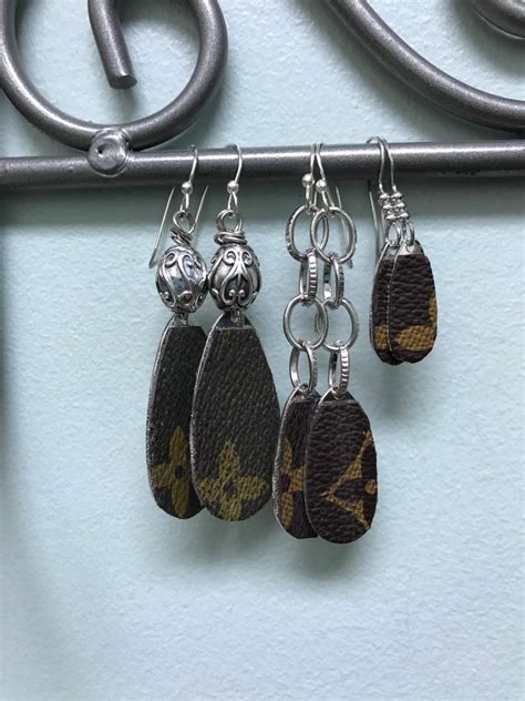 louis vuitton faux leather earrings.